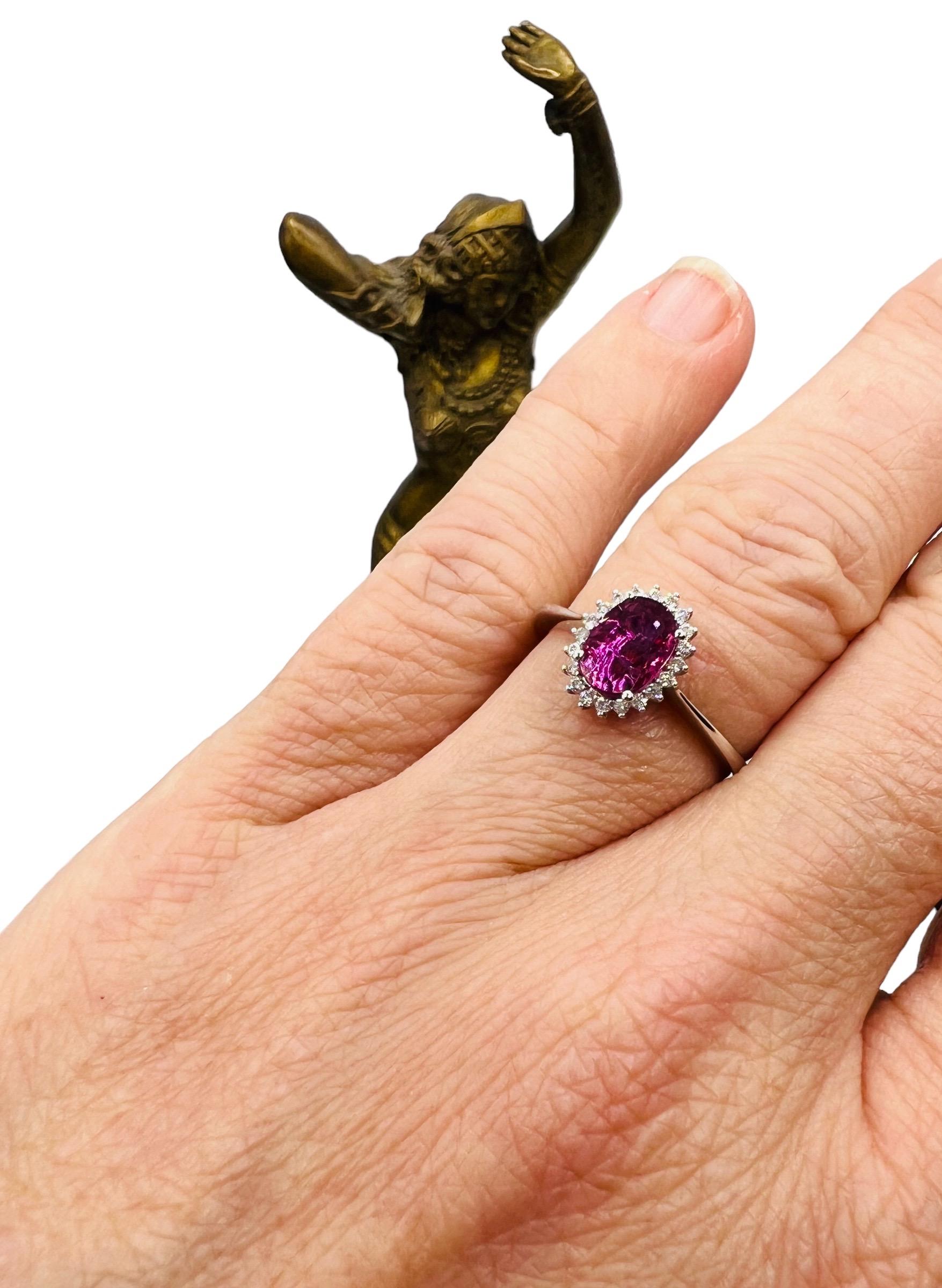 Oval Cut 18 Carat Engagement Ring Set Pink Sapphire Surrounded by Diamonds For Sale