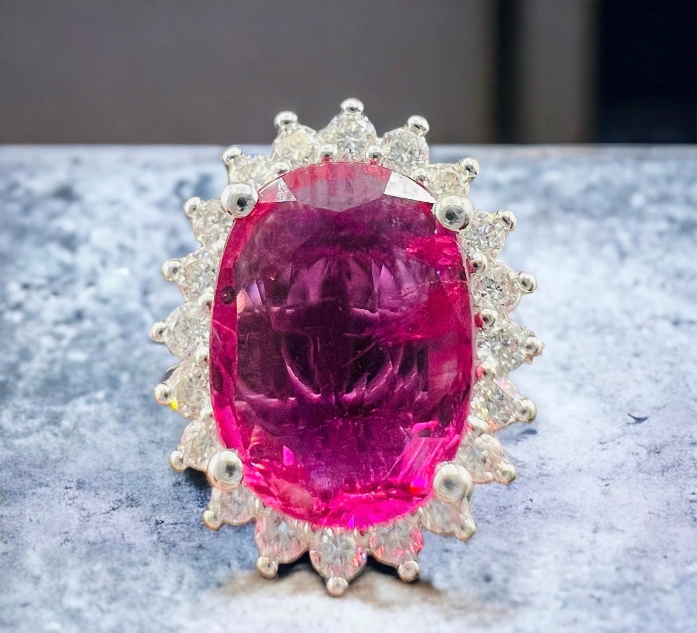 Women's 18 Carat Engagement Ring Set Pink Sapphire Surrounded by Diamonds For Sale