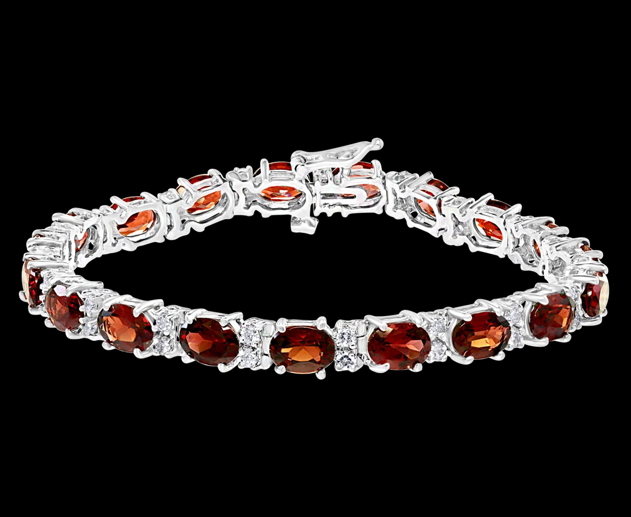 This exceptionally affordable Tennis bracelet has 19 stones of oval shape Garnet
Beautiful colors , very Vibrant
Size of the stone is approximately 7X5 mm
Each Garnet is spaced by two brilliant round Diamonds.
Total weight of the Diamond is