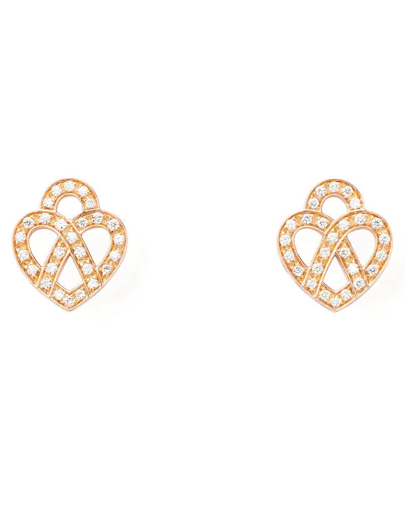 The timeless Poiray collection, Coeur Entrelacé, reveals itself in pure lines, with generous curves, and is dressed in gold or diamonds to celebrate all loves.

Cœur Entrelacé earrings in rose gold and diamonds.

Diamond - 0.2 carat 

Please note