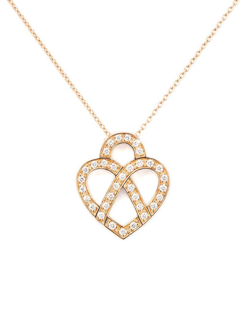 The timeless Poiray collection Cœur Entrelacé is revealed in pure lines, with generous curves, and is dressed in gold or diamonds to celebrate all loves.

Cœur Entrelacé necklace, small model in rose gold paved with diamonds.

Diamond - 0.15 carat