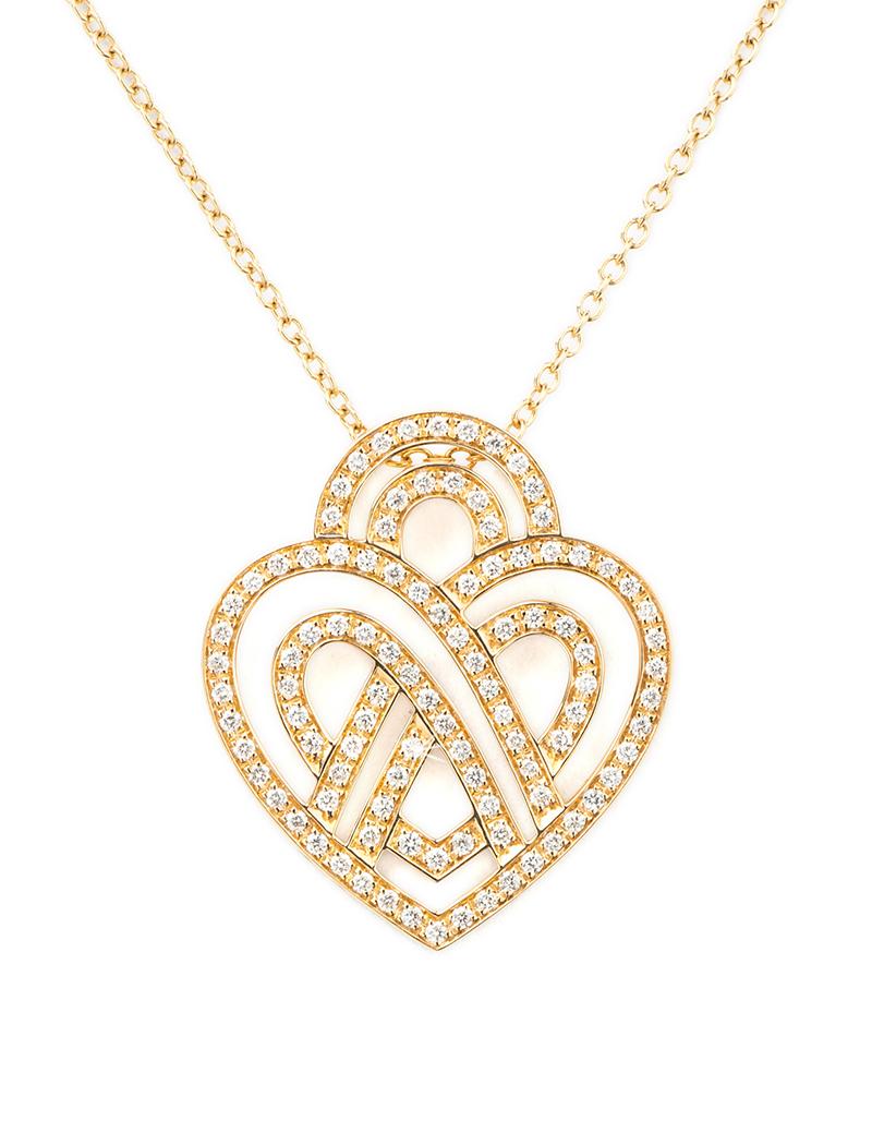 The timeless Poiray collection Cœur Entrelacé is revealed in pure lines, with generous curves, and is dressed in gold or diamonds to celebrate all loves.

Cœur Entrelacé necklace, small model in yellow gold paved with diamonds.

Diamond - 0.4 carat