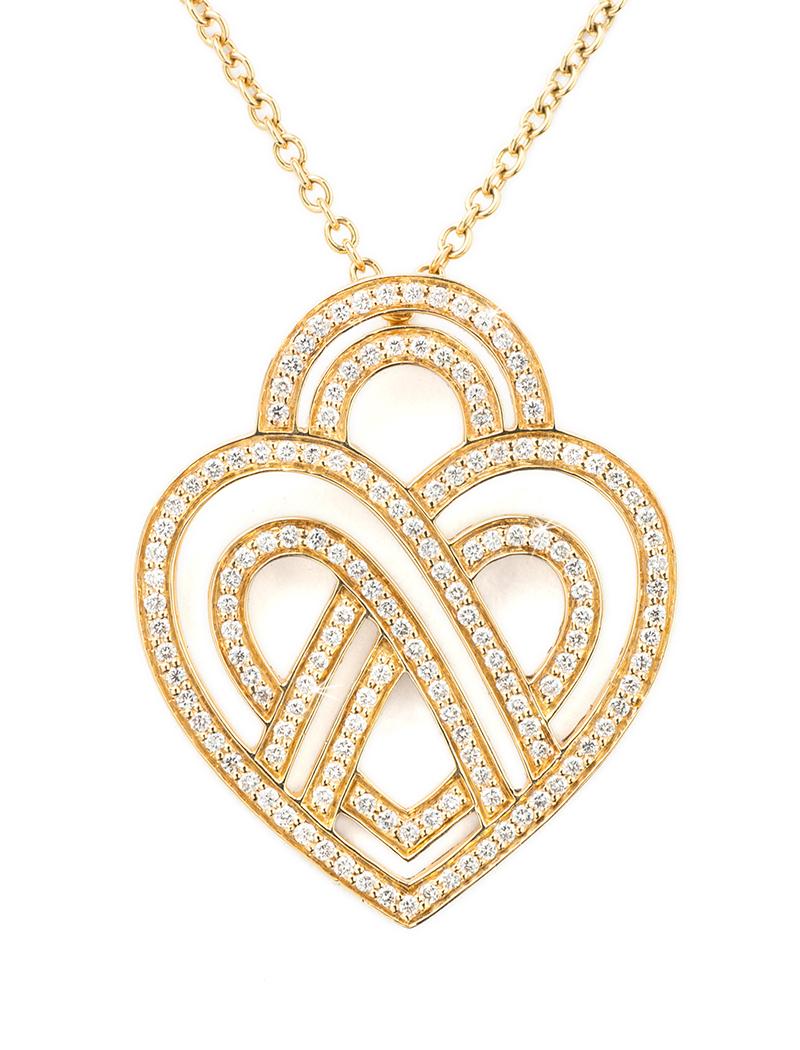 The timeless Poiray collection Cœur Entrelacé is revealed in pure lines, with generous curves, and is dressed in gold or diamonds to celebrate all loves.

Cœur Entrelacé necklace, large model in yellow gold paved with diamonds.

Diamond - 0.6 carat