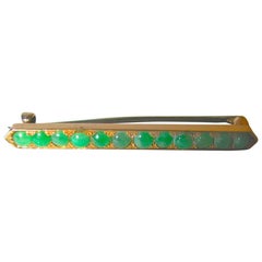 18 Carat Gold and Multi-Cabouchon Jade Bar Brooch Dated circa 1920, Hong Kong