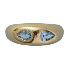 Bague jonc en or 18 carats avec aigues-marines