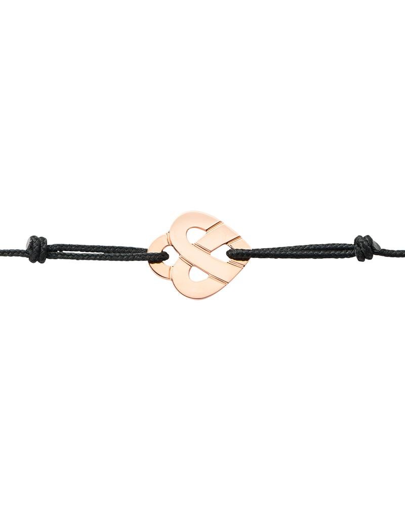 The timeless Poiray collection Cœur Entrelacé is revealed in pure lines, with generous curves, and is dressed in gold or diamonds to celebrate all loves.

Cœur Entrelacé bracelet in rose gold on cord.

Please note that the carat weight, number of