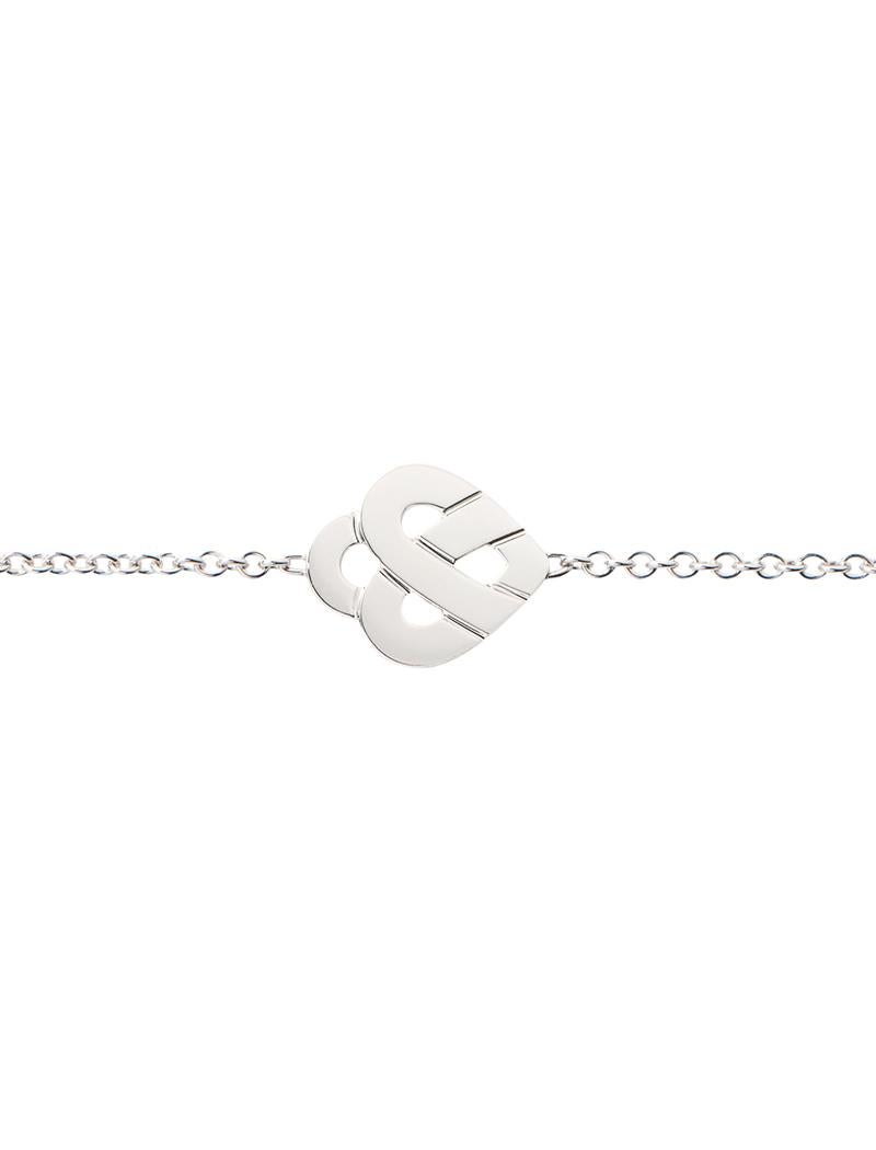 The timeless Poiray collection Cœur Entrelacé is revealed in pure lines, with generous curves, and is dressed in gold or diamonds to celebrate all loves.

Cœur Entrelacé bracelet in white gold on chain.

Please note that the carat weight, number of