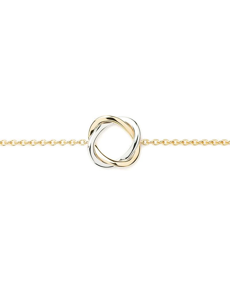 Die Kollektion Tresse mit ihren zwei zart ineinander verschlungenen Goldsträngen ist von der Eleganz der Couture inspiriert und symbolisiert das Band der Liebe.

Tresse-Armband aus Gelb- und Weißgold an einer Kette aus Gelbgold.

Größe des Musters: