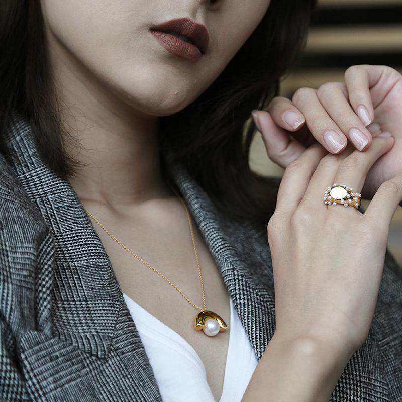18K Gold and Pearl ring, earrings and necklace suite. Mistova is known for its sculptural forms and innovative designs. This beautifully crafted suite is playful and luxury. Every piece of jewelry has pearls integrated and made from 18K gold. Every