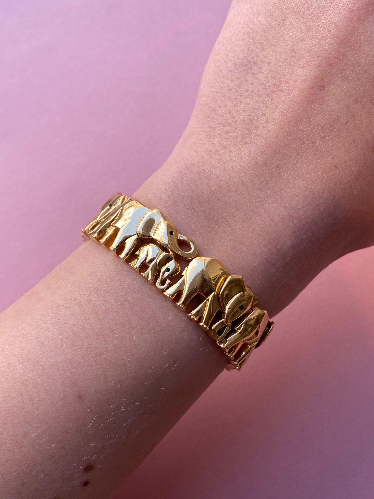 Just in: The gorgeous, collectible, 18-carat flexible yellow gold bracelet from the Khandy collection featuring 11 elephants in various postures and sizes and with tsavorite eyes. The lock is concealed in one ear. Signed and numbered: Cartier,