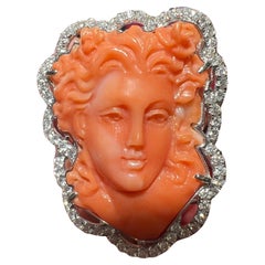 18 Carat Gold Cocktail Ring: Coral Cameo Ring Surrounded by Diamonds