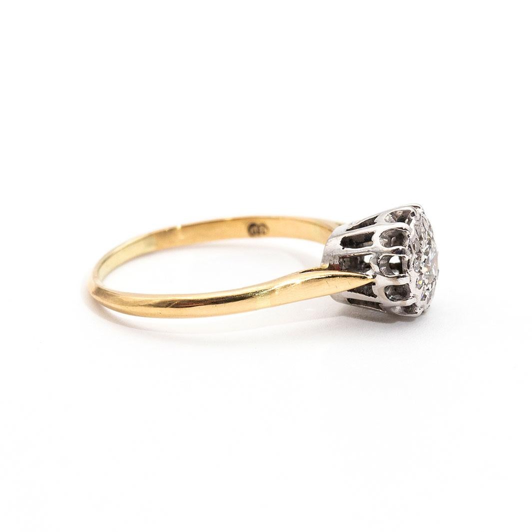 Forged in 18 carat gold is this ever so darling vintage cluster ring featuring a bright centre round brilliant cut diamond surrounded by a border of sparkling round single cut diamonds. We have name this vintage splendour the The Daisy Ring.  The
