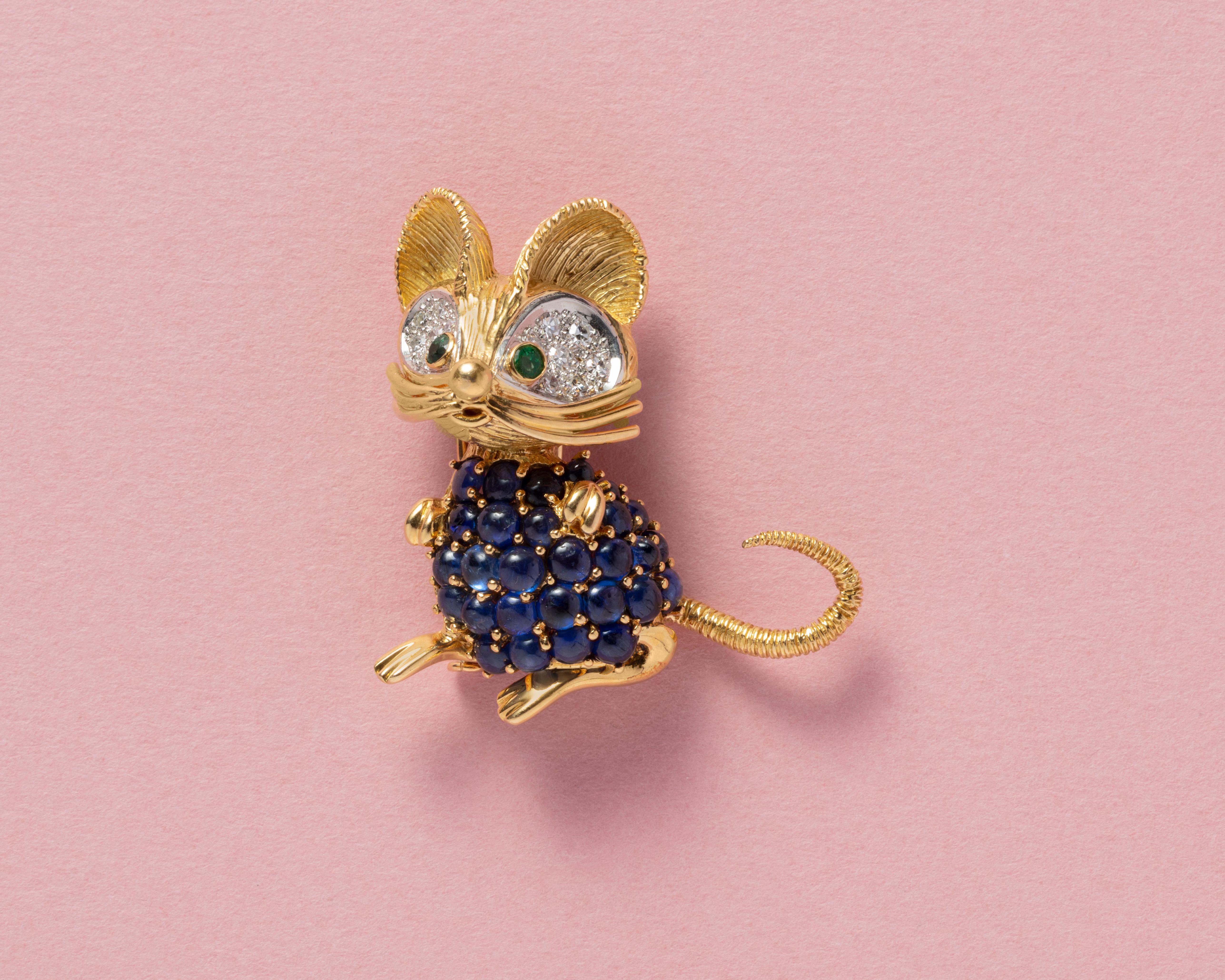 A sweet French mouse brooch with a sapphire (app. 6.5 carat) body and diamond and emerald eyes retailed by Bonebakker circa 1960. 

weight: 20.88 grams
dimensions: 4 x 3.6 cm