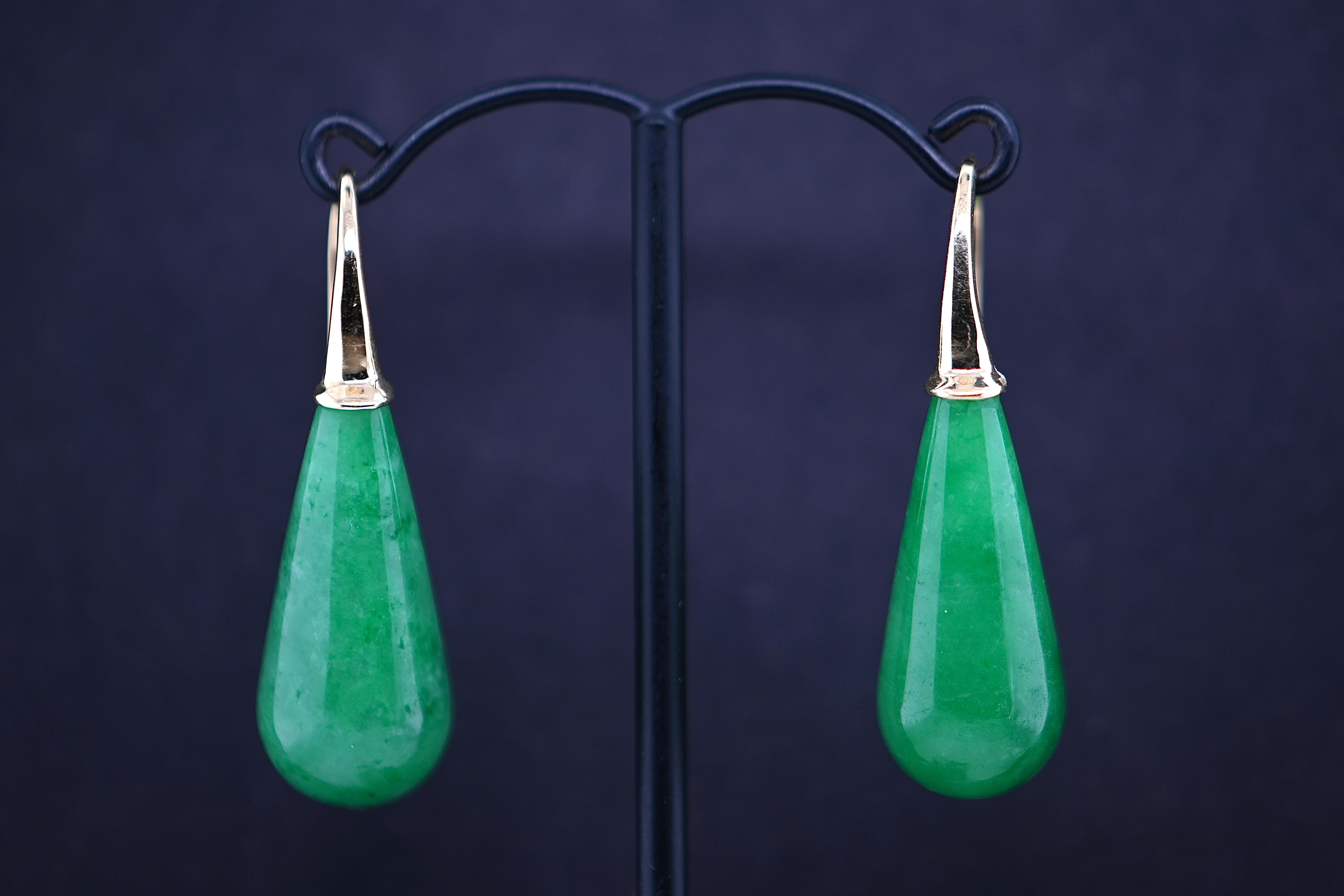 Elegant and refined, these jade stone earrings exude sophistication. Originating from Malaysia, the jade stones are carefully selected for their exquisite quality and rich green hue. Each earring features a lustrous 18-carat gold hook meticulously