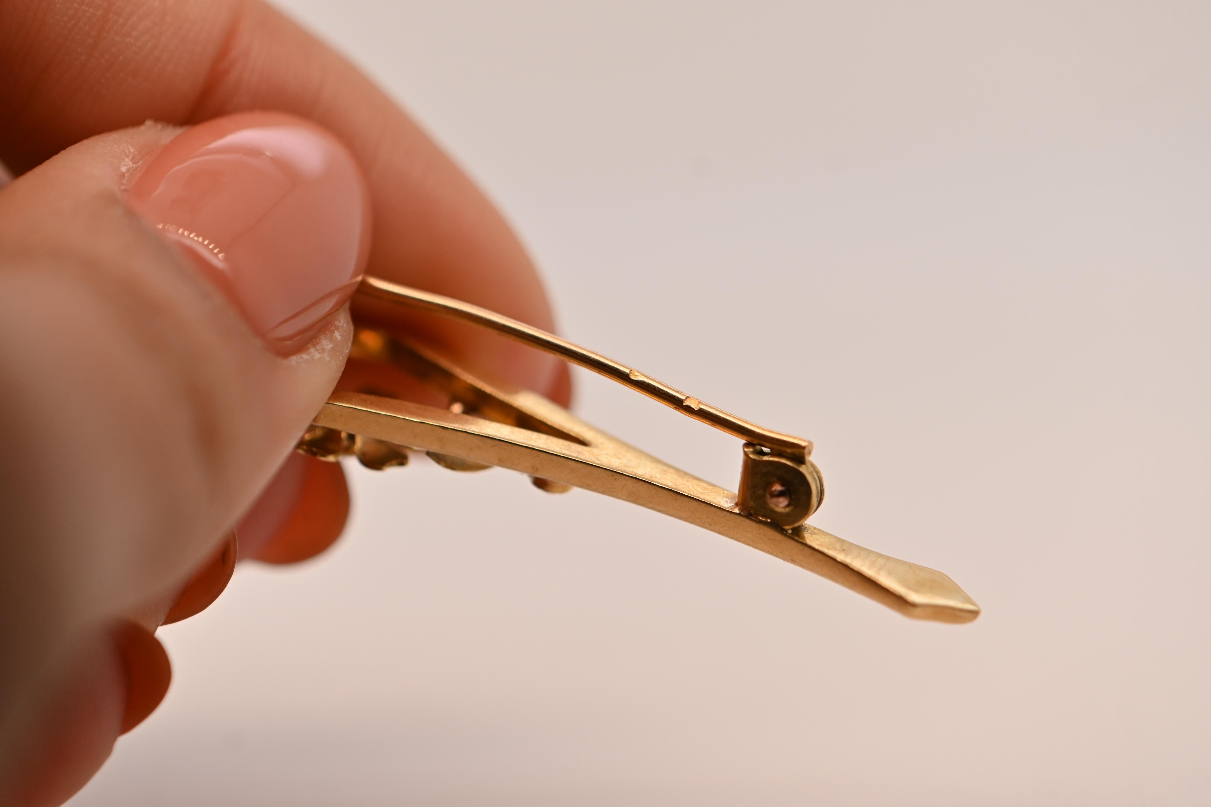 Women's or Men's 18 Carat Gold Flower Brooch Adorned With A Ruby For Sale