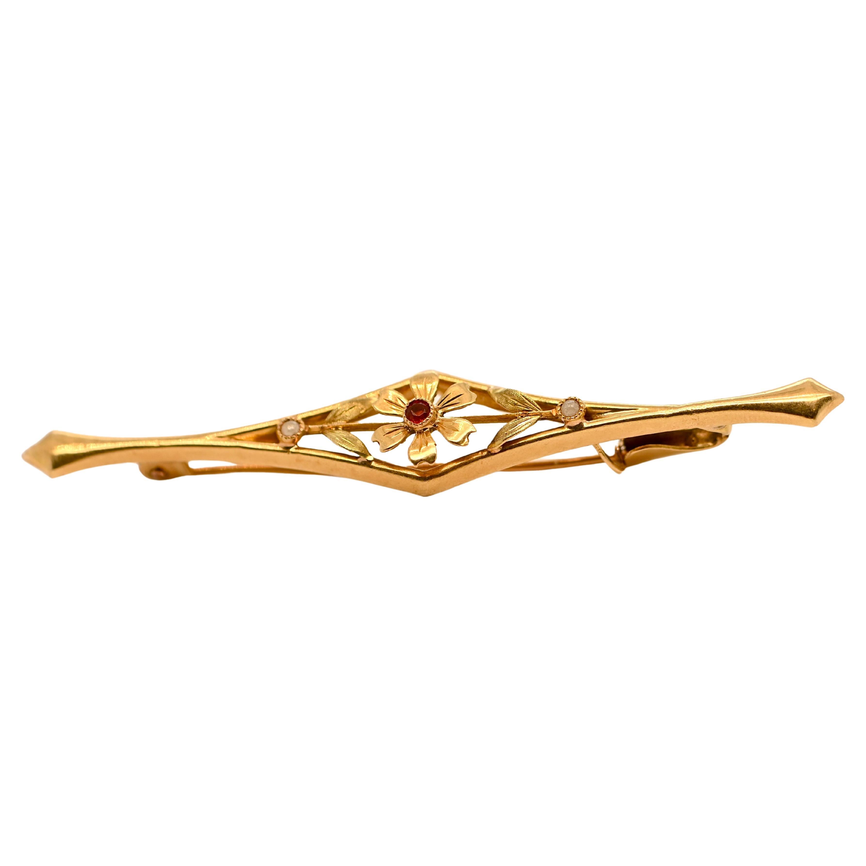 18 Carat Gold Flower Brooch Adorned With A Ruby
