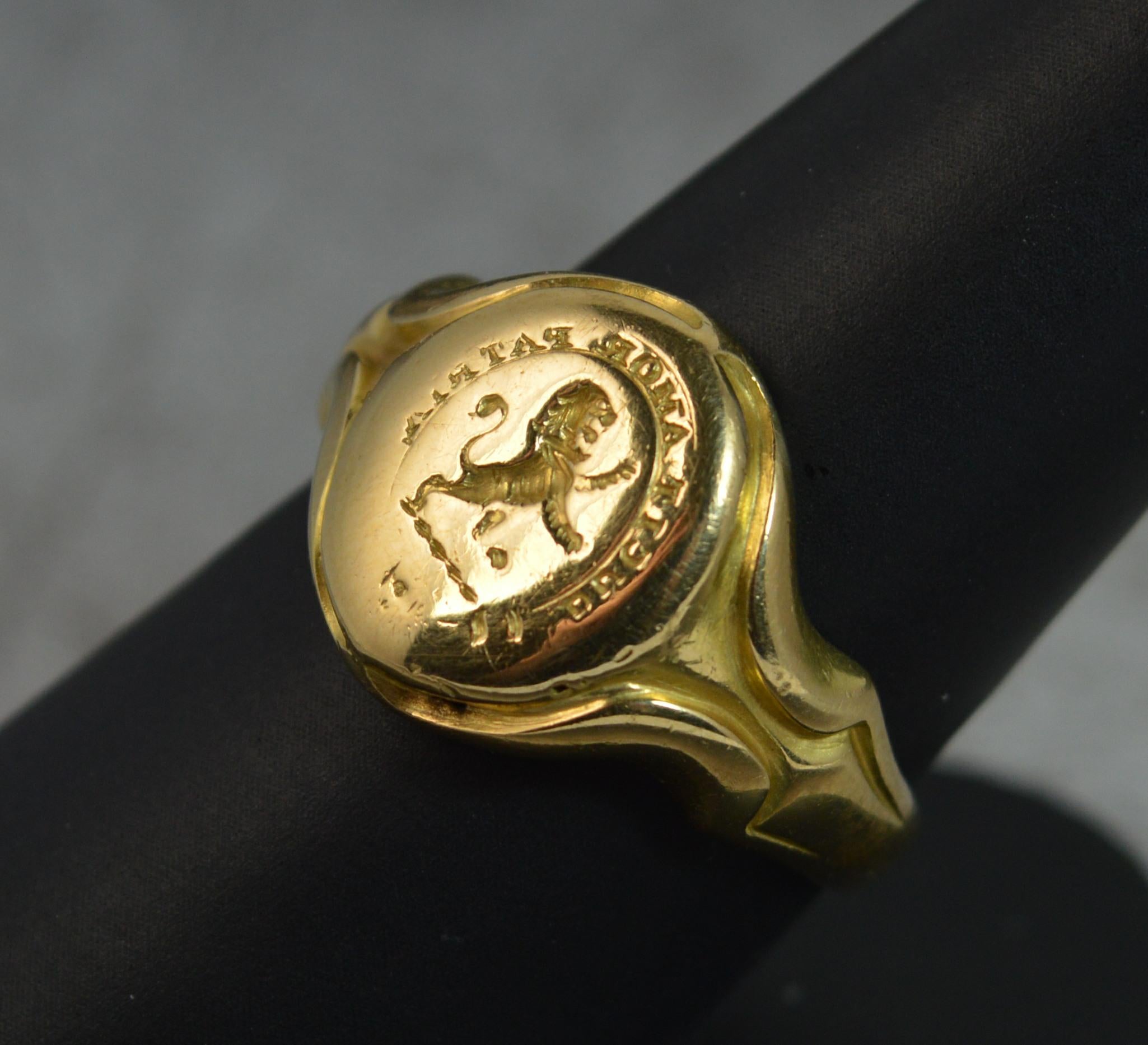 A superb intaglio seal signet ring. c1880.
Solid 18 carat yellow gold example.
Designed with a family crest which depicts a lion passant to centre with Latin moto border which translates to The Love of The Country Leads Me.
12mm x 15mm head