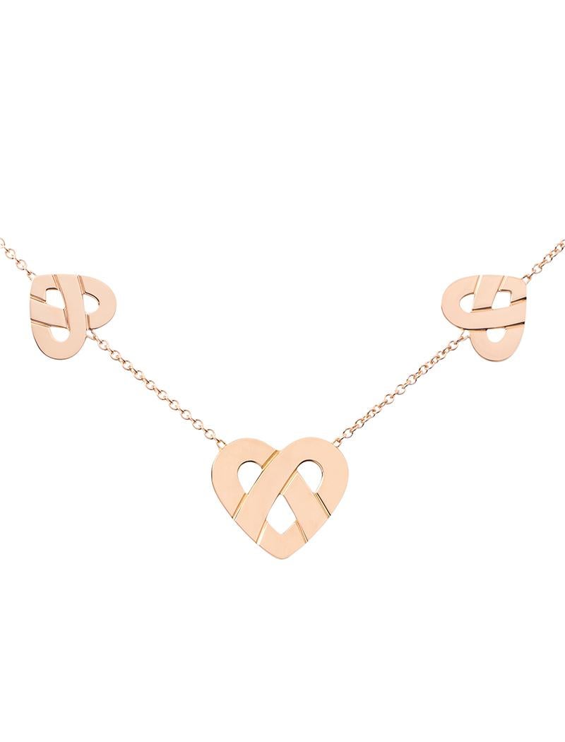 The timeless Poiray collection Cœur Entrelacé is revealed in pure lines, with generous curves, and is dressed in gold or diamonds to celebrate all loves.

Interlaced heart necklace with three hearts on a rose gold chain.

Please note that the carat