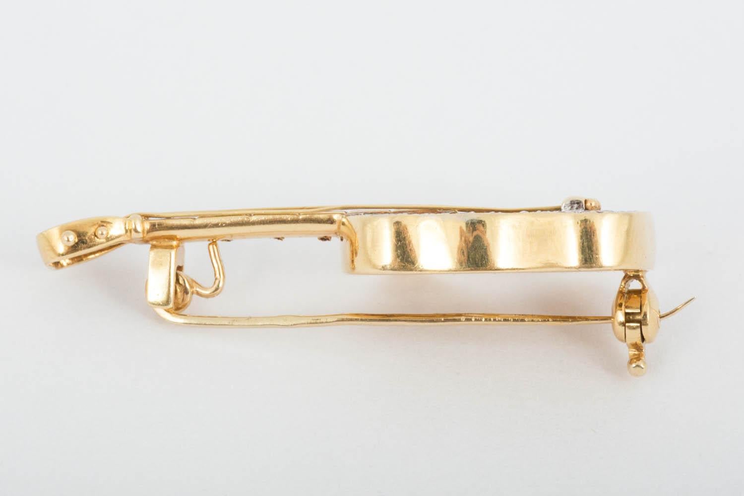 Modern brooch in shape of guitar was made in France. Fine details include Rubies in the frets