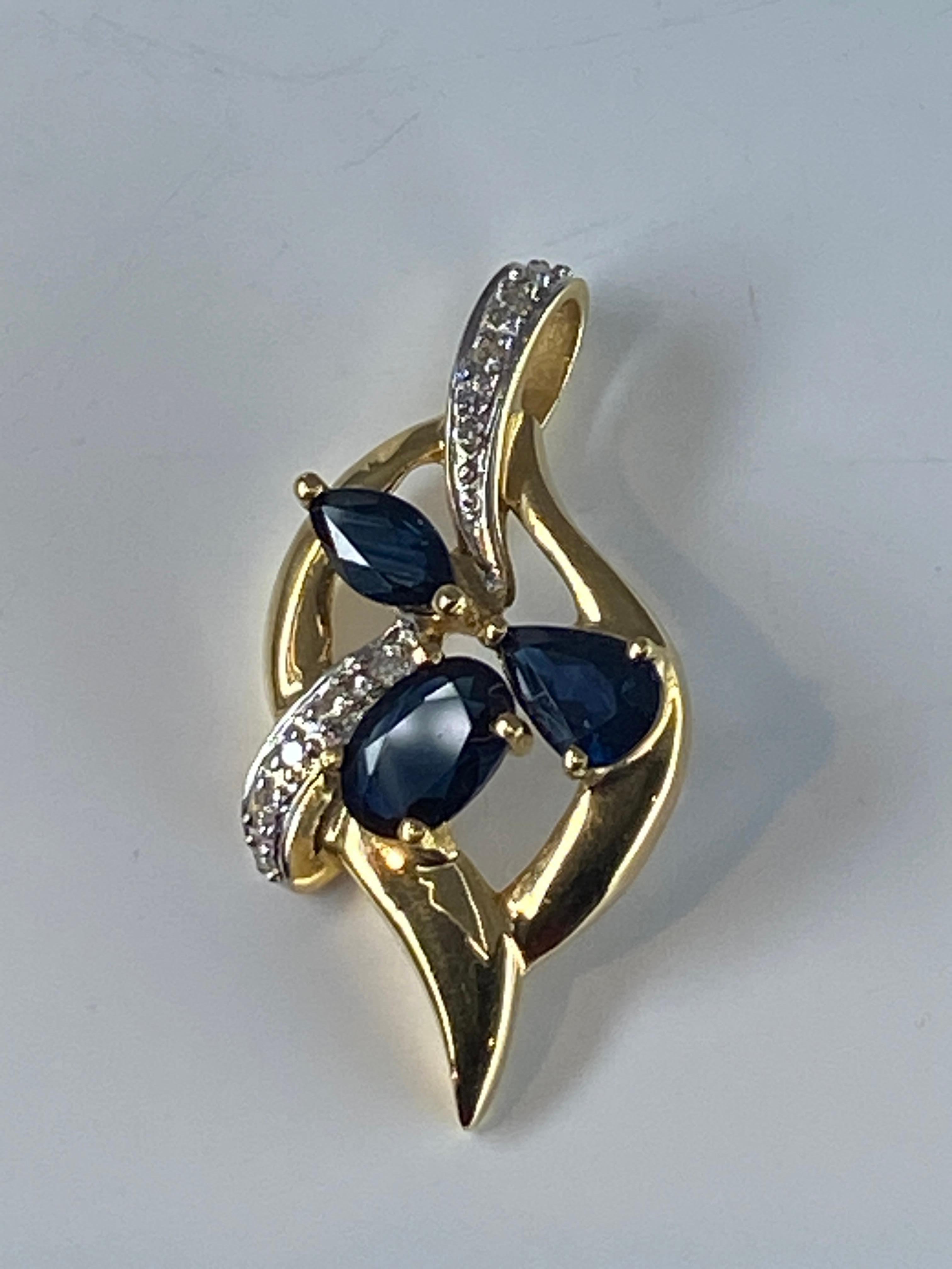 Modern 18 Carat Gold Pendant Set with 3 Pear, Shaped Sapphires and 14 Diamonds For Sale