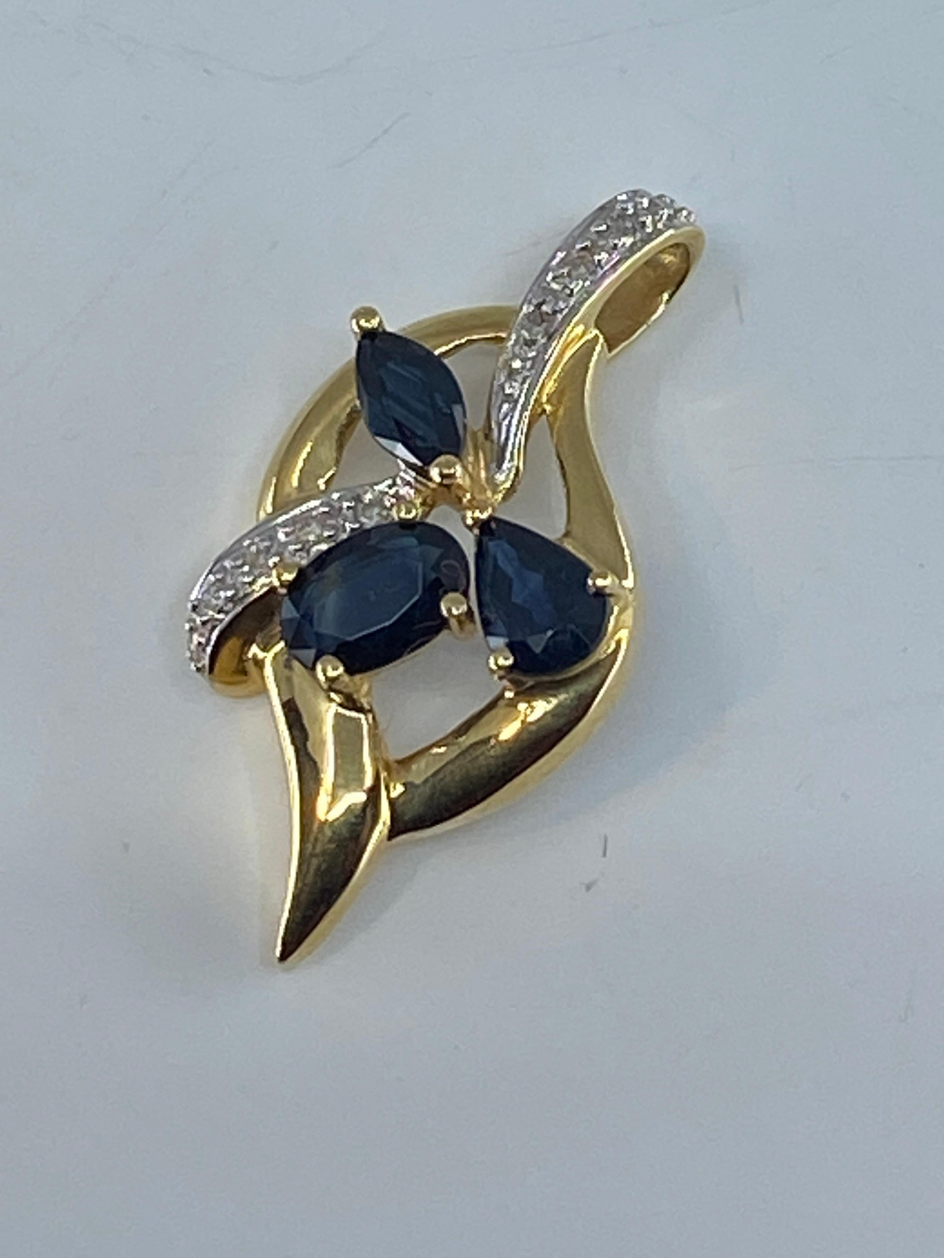 18 Carat Gold Pendant Set with 3 Pear, Shaped Sapphires and 14 Diamonds For Sale 1