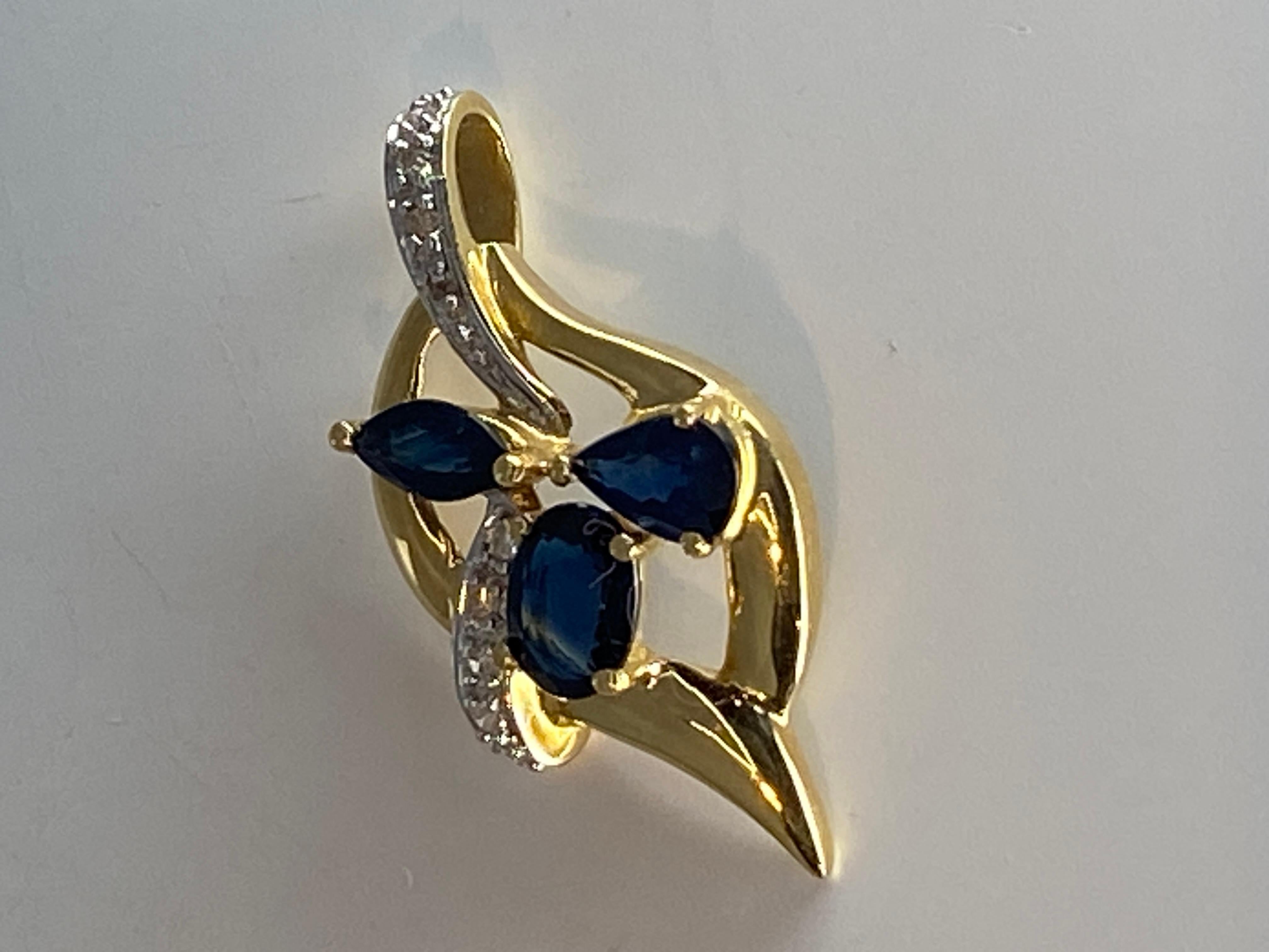 18 Carat Gold Pendant Set with 3 Pear, Shaped Sapphires and 14 Diamonds For Sale 3