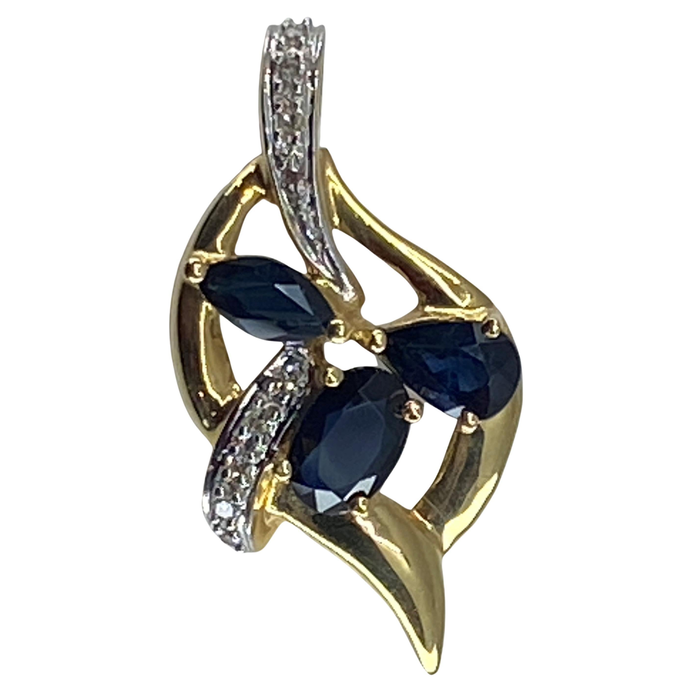 18 Carat Gold Pendant Set with 3 Pear, Shaped Sapphires and 14 Diamonds For Sale
