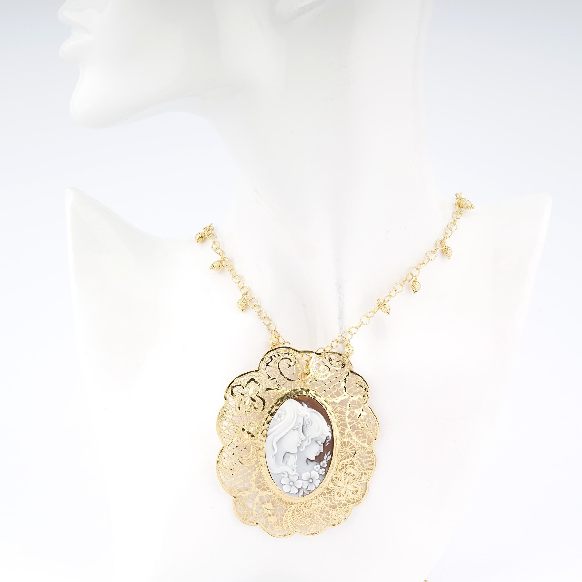 18 carat Gold Plated 925 Sterling Silver Sea Shell with 40mm Cameo Necklace 76cm. Fully handcarved Portrait on a sea shell cameo set in a 18kt Gold plated silver pendant necklace. Carvings are performed by our master artisans with generations of