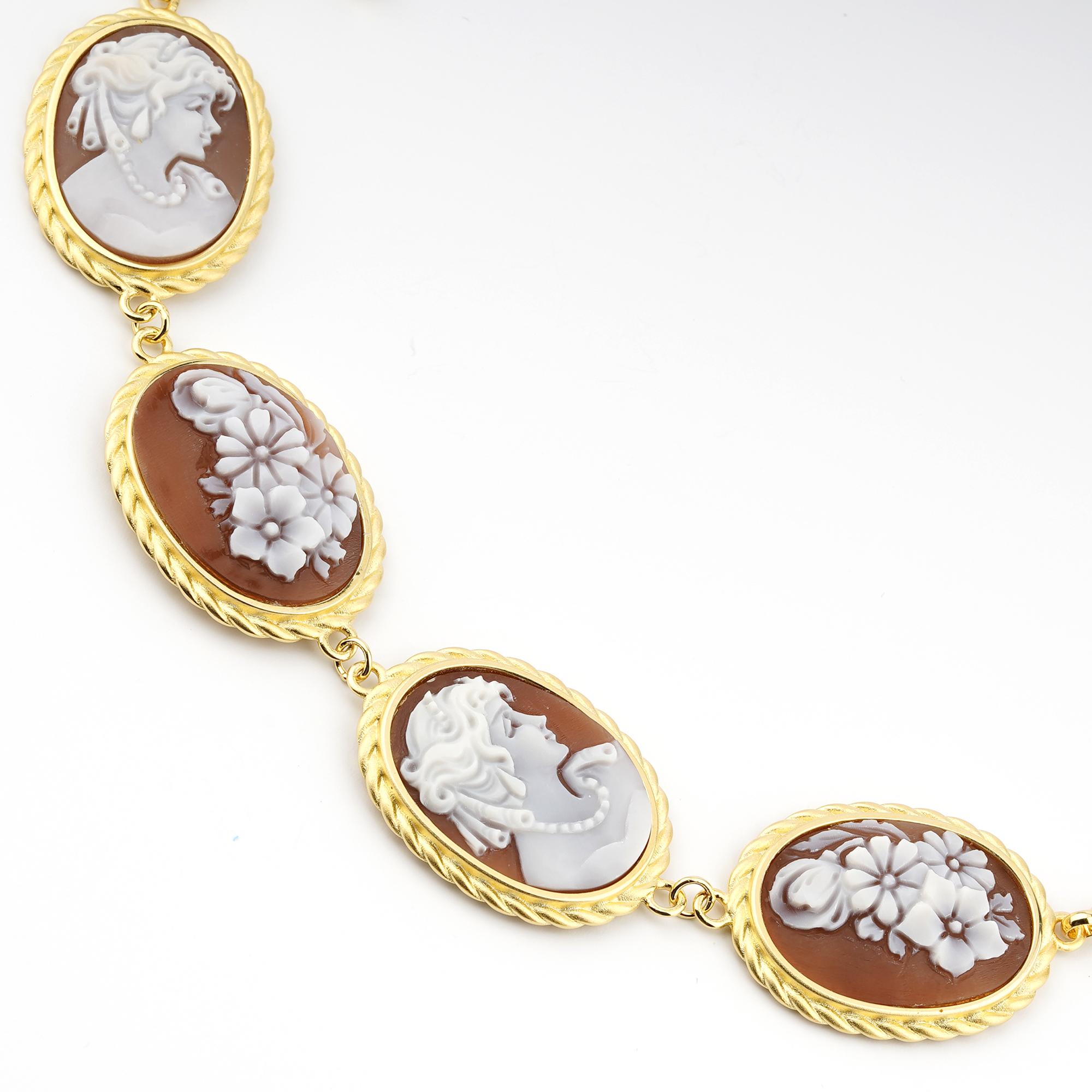 18 carat Gold Plated 925 Sterling Silver with 4 pcs 24mm Sea Shell Cameos bracelet. Fully handcarved flowers and portraits on a sea shell cameo set in a 18kt Gold plated silver Bracelet. Carvings are performed by our master artisans with generations