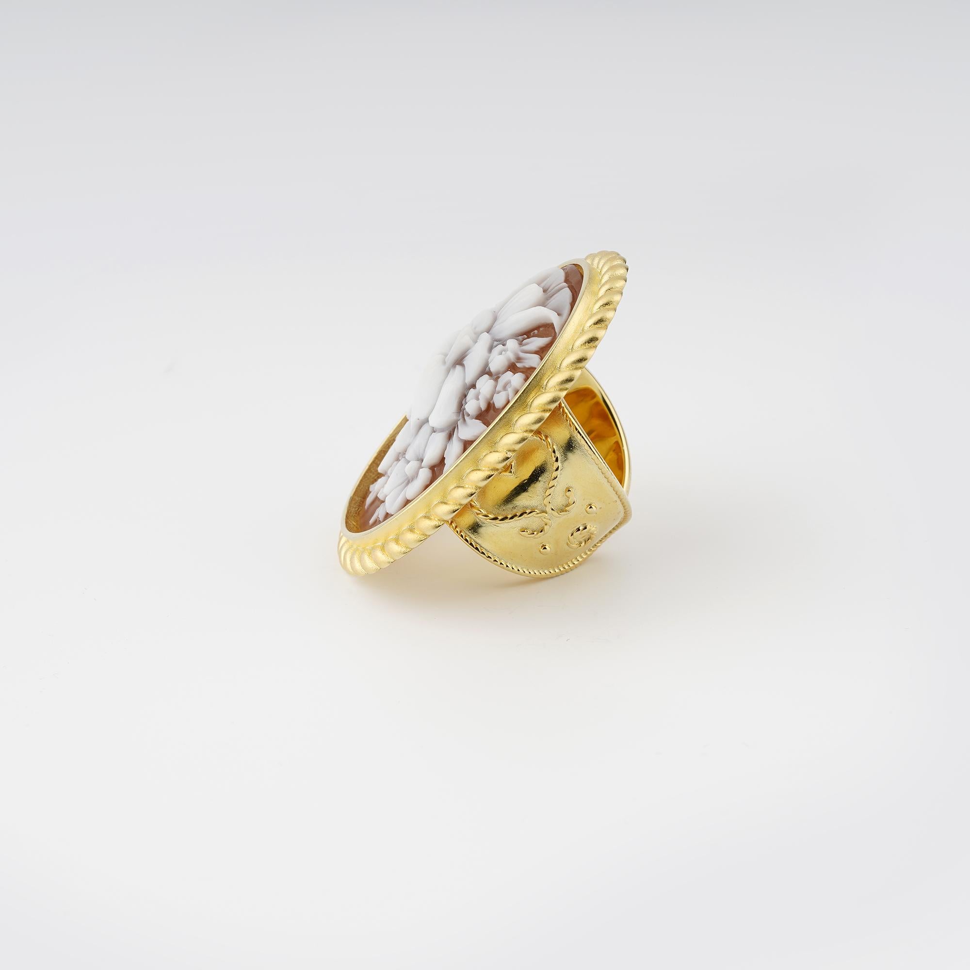 18 carat Gold Plated 925 Sterling Silver with 38mm Sea Shell Cameo adjustable ring. Fully handcarved Bouquet on a sea shell cameo set in a 18kt Gold plated silver adjustable shank ring. Carvings are performed by our master artisans with generations