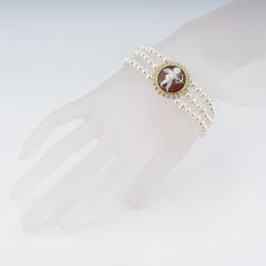 Cameo Italiano Sea shell cameo and 3 row-Pearl bracelet.