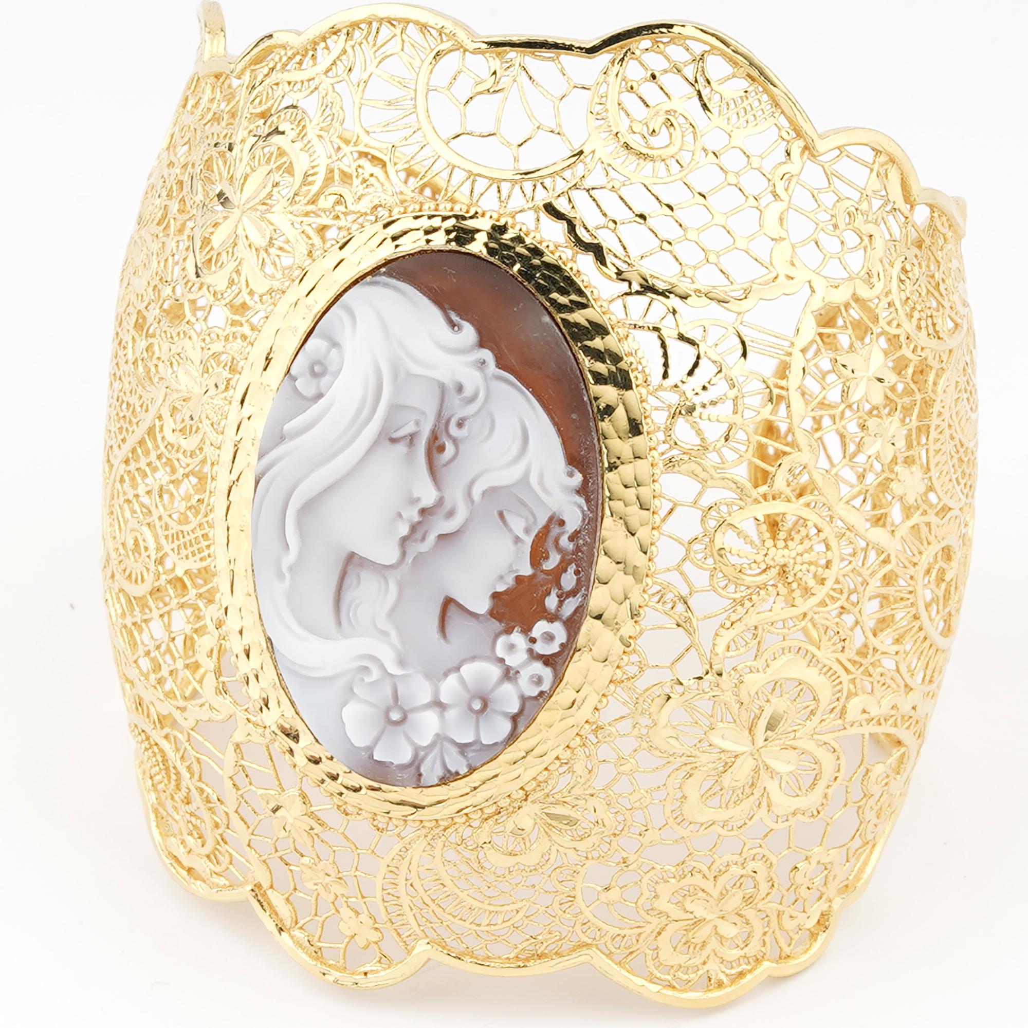 18 carat Gold Plated 925 Sterling Silver with 40mm Sea Shell Cameo Bracelet 16cm. Fully handcarved Portrait on a sea shell cameo set in a 18kt Gold plated silver cuff bracelet. Carvings are performed by our master artisans with generations of
