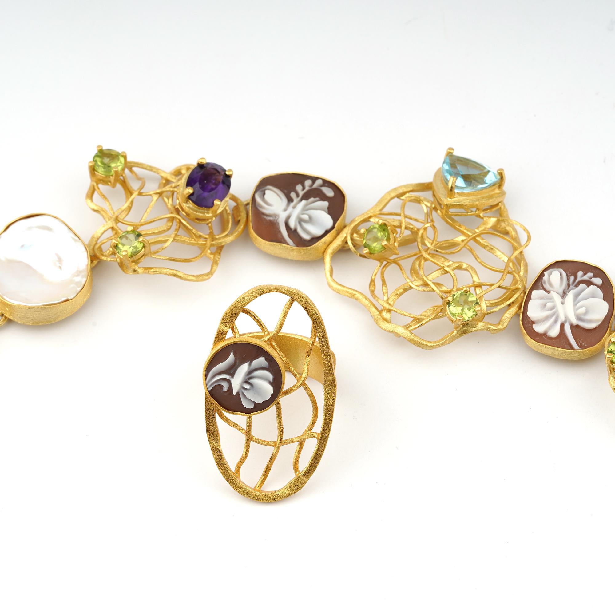 18 carat Gold Plated 925Sterling Silver SeaShell 12/16/18mm cameos cocktail Ring and Bracelet set. Fully handcarved Flowers on sea shell cameos set in a Gold plated plated 925 silver set of Ring and Bracelet with Topaz, peridot, amethyst and