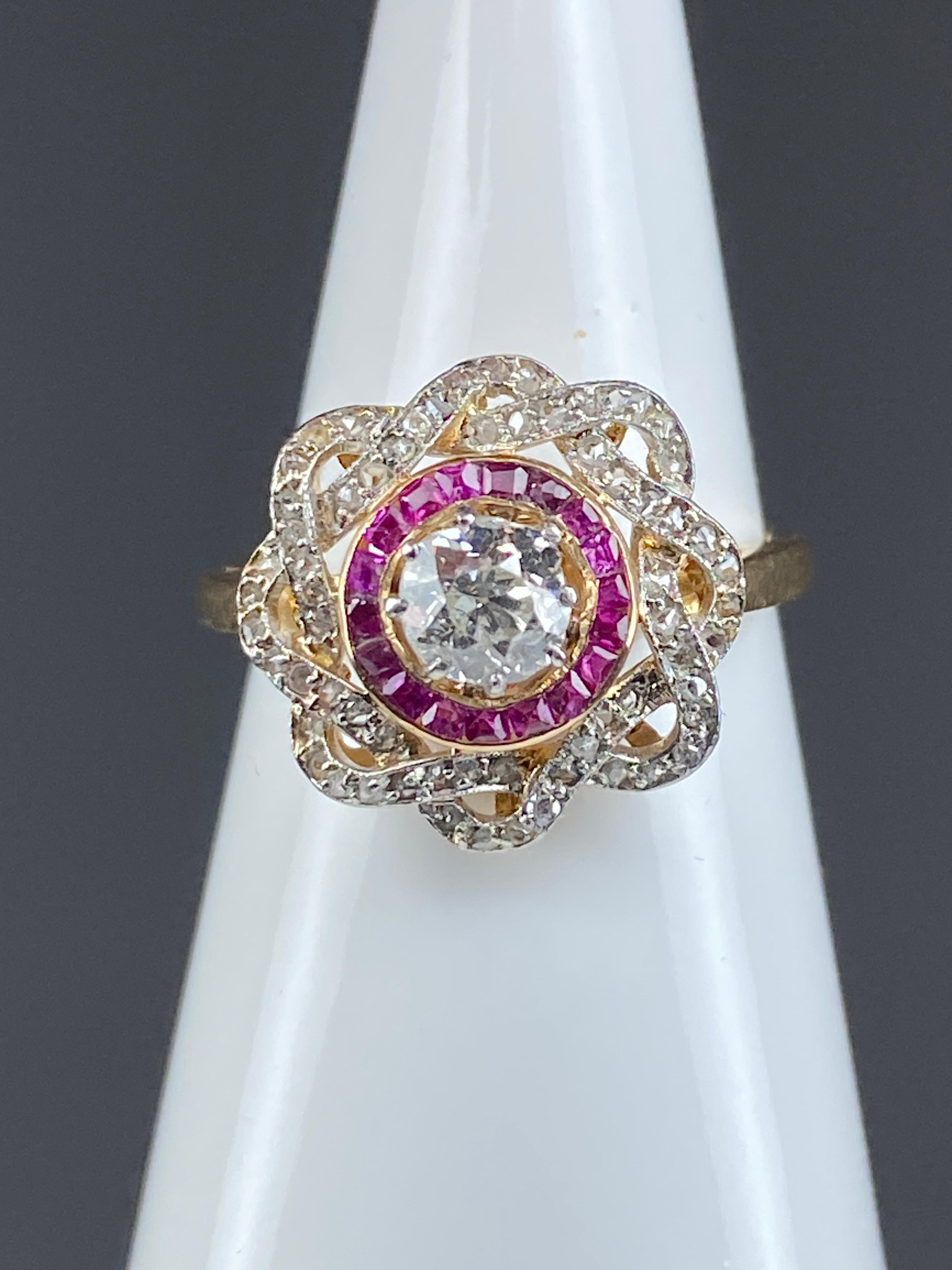 Round Cut 18 Carat Gold Ring, Flower Model, Set with Diamonds and Rubies, circa 1900