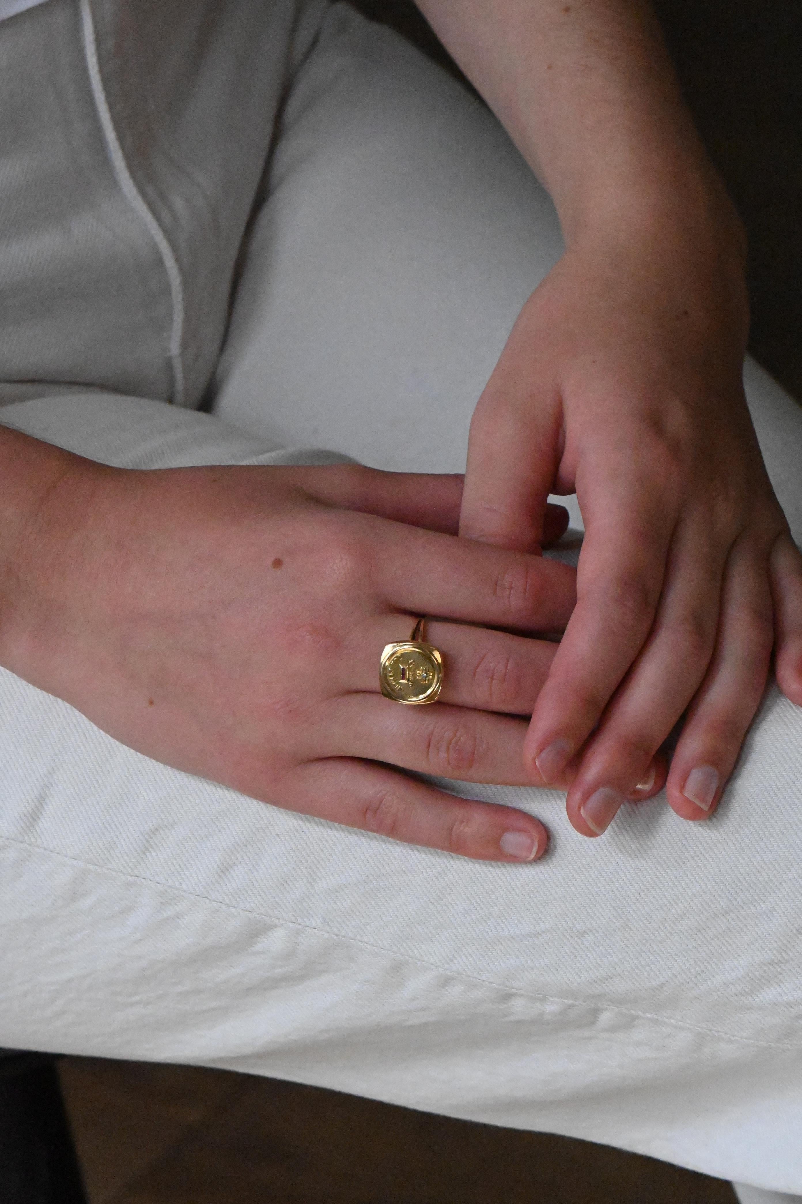 This ring by Augis is an exceptional piece in 750 thousandth yellow gold, imbued with romance with the emblematic inscription 