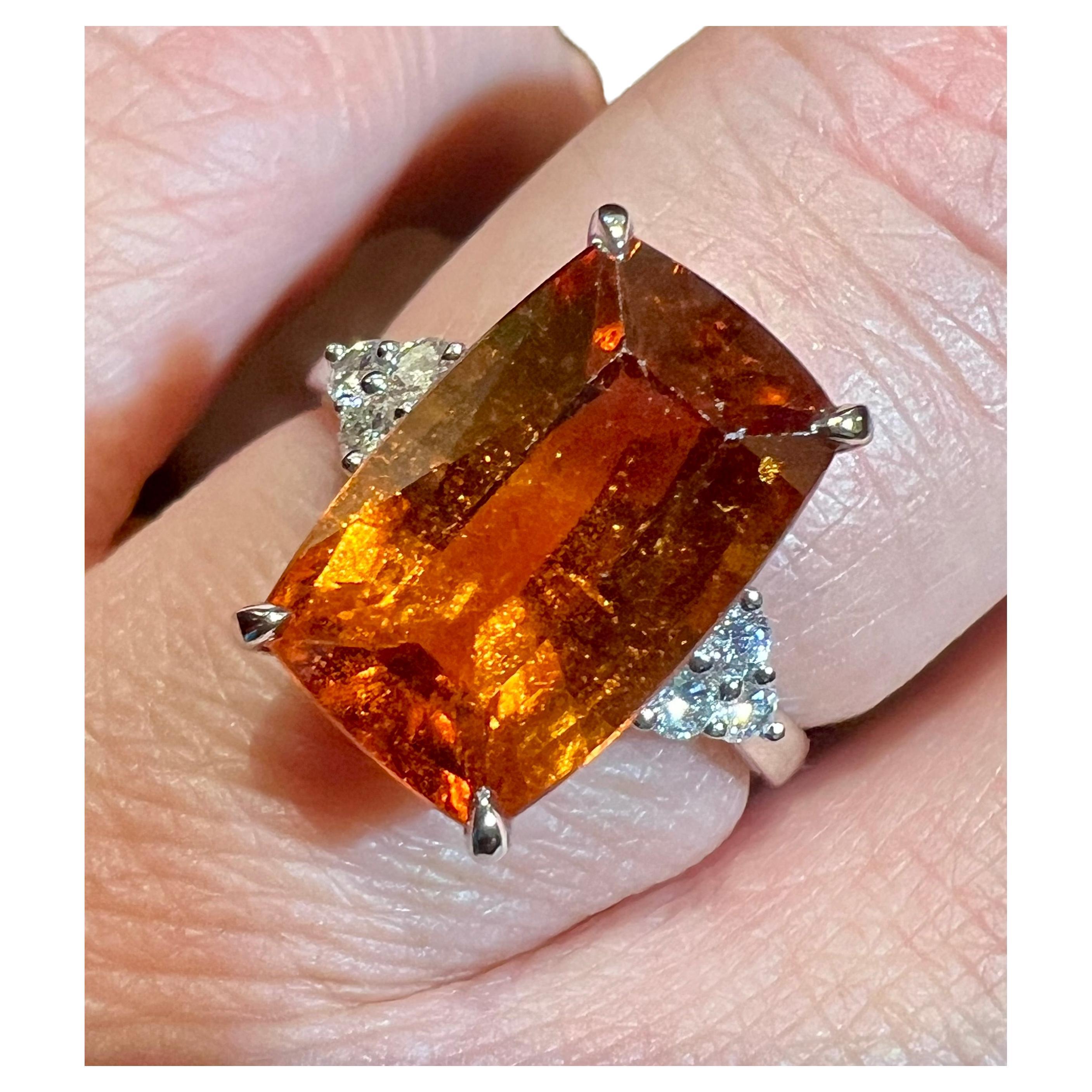 18 Carat Gold Ring Set With  a 6.40 ct Spessartite Garnet And 6 Diamonds For Sale