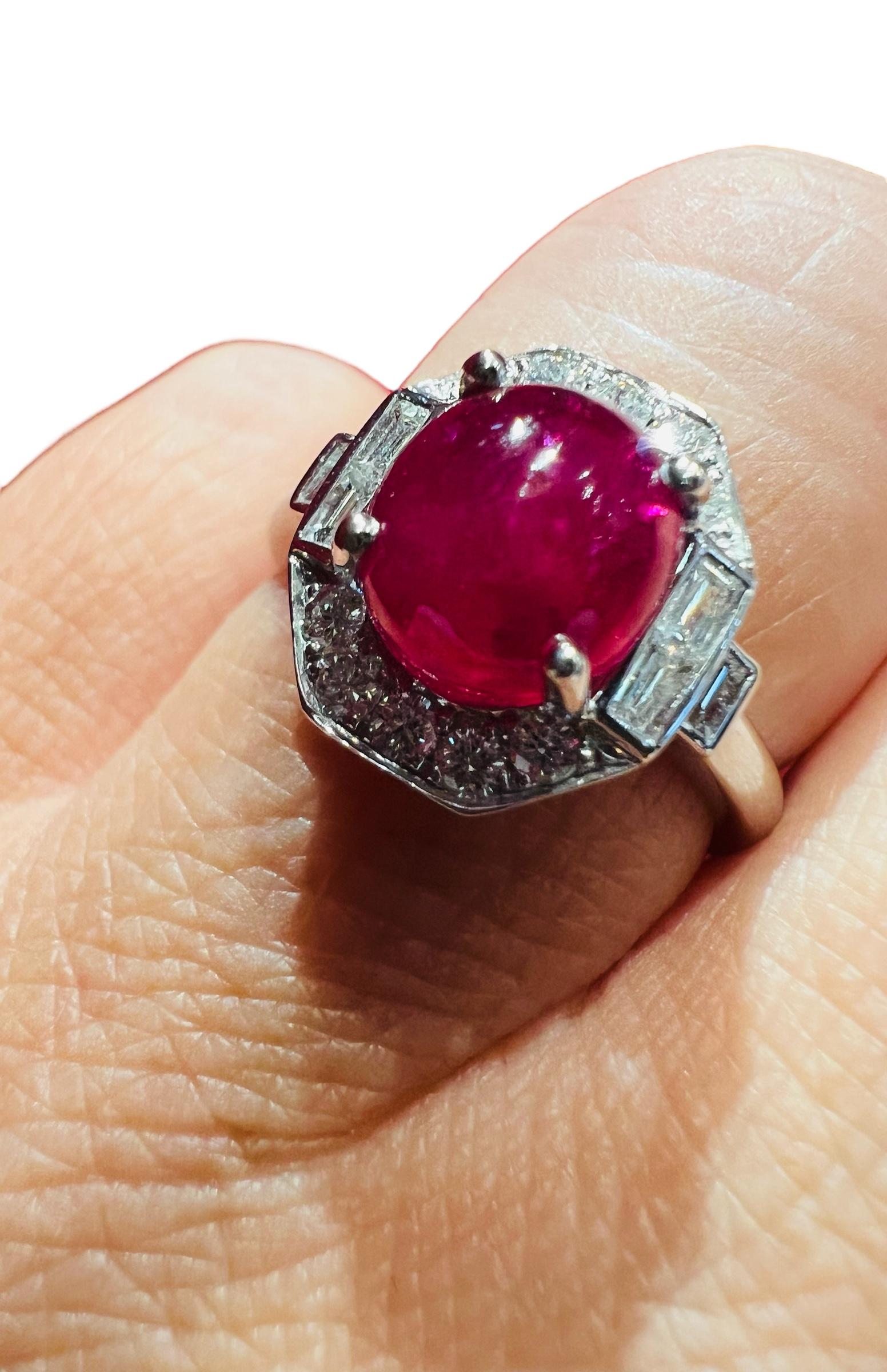 18 Carat Gold Ring Set With A Ruby Cabochon Surrounded By Diamonds 5