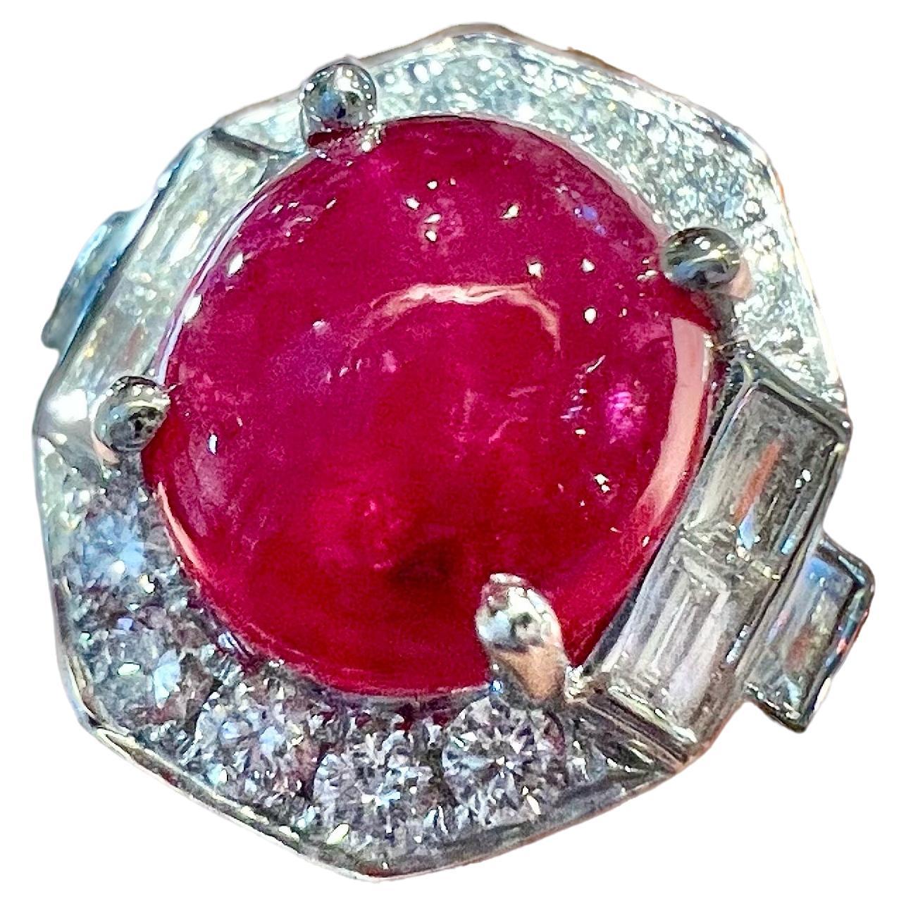 Art Deco 18 Carat Gold Ring Set With A Ruby Cabochon Surrounded By Diamonds