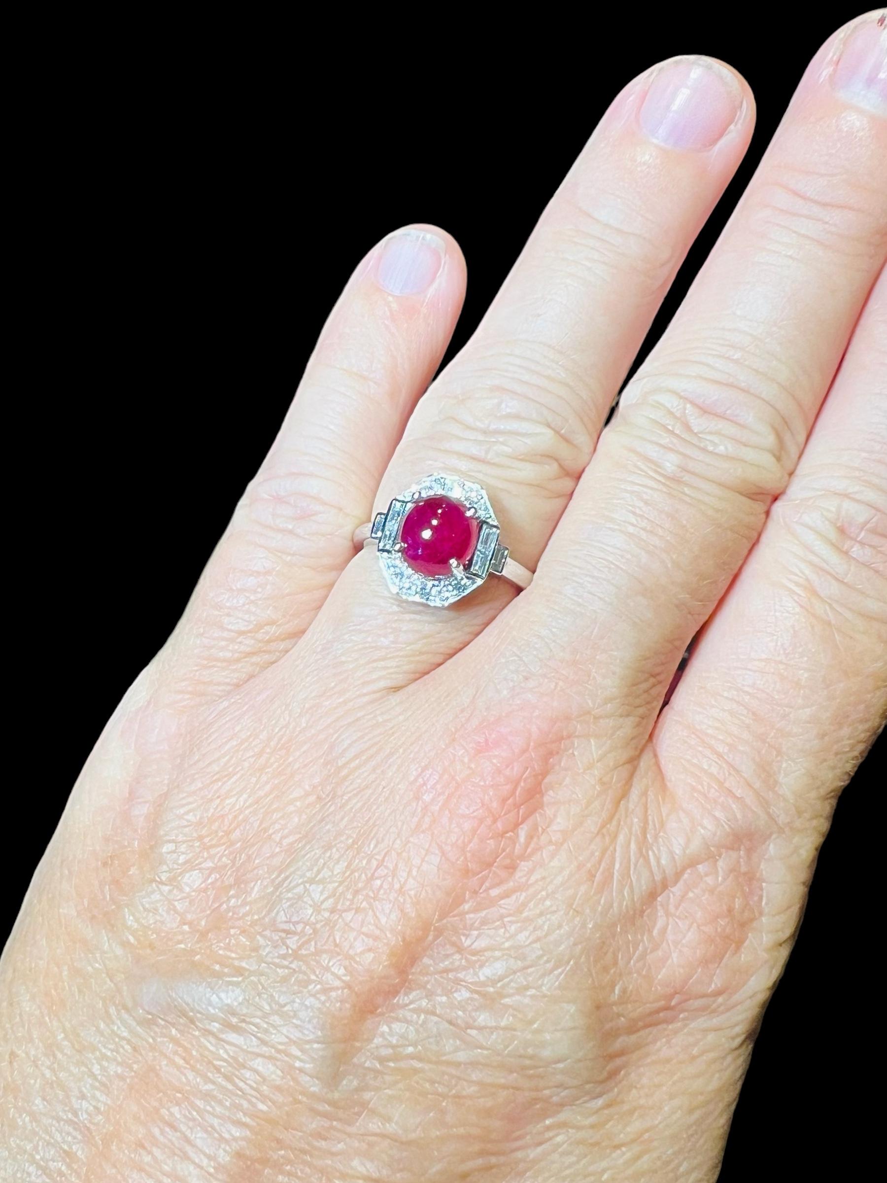 18 Carat Gold Ring Set With A Ruby Cabochon Surrounded By Diamonds 1
