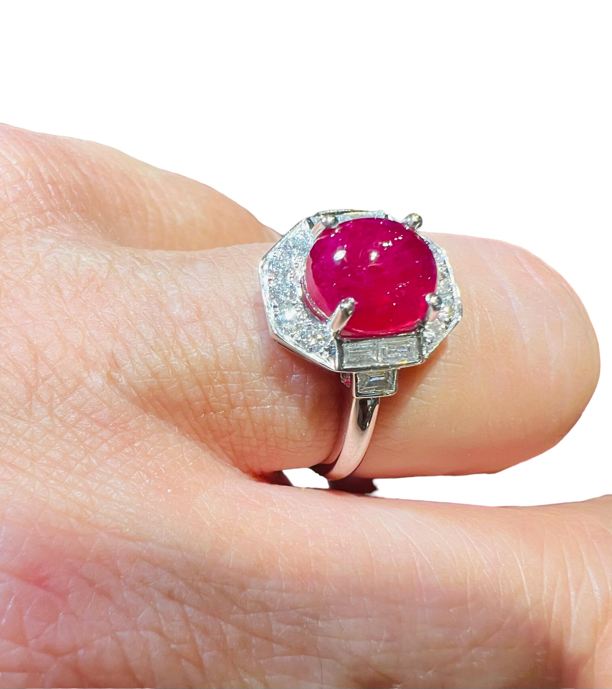 18 Carat Gold Ring Set With A Ruby Cabochon Surrounded By Diamonds 2
