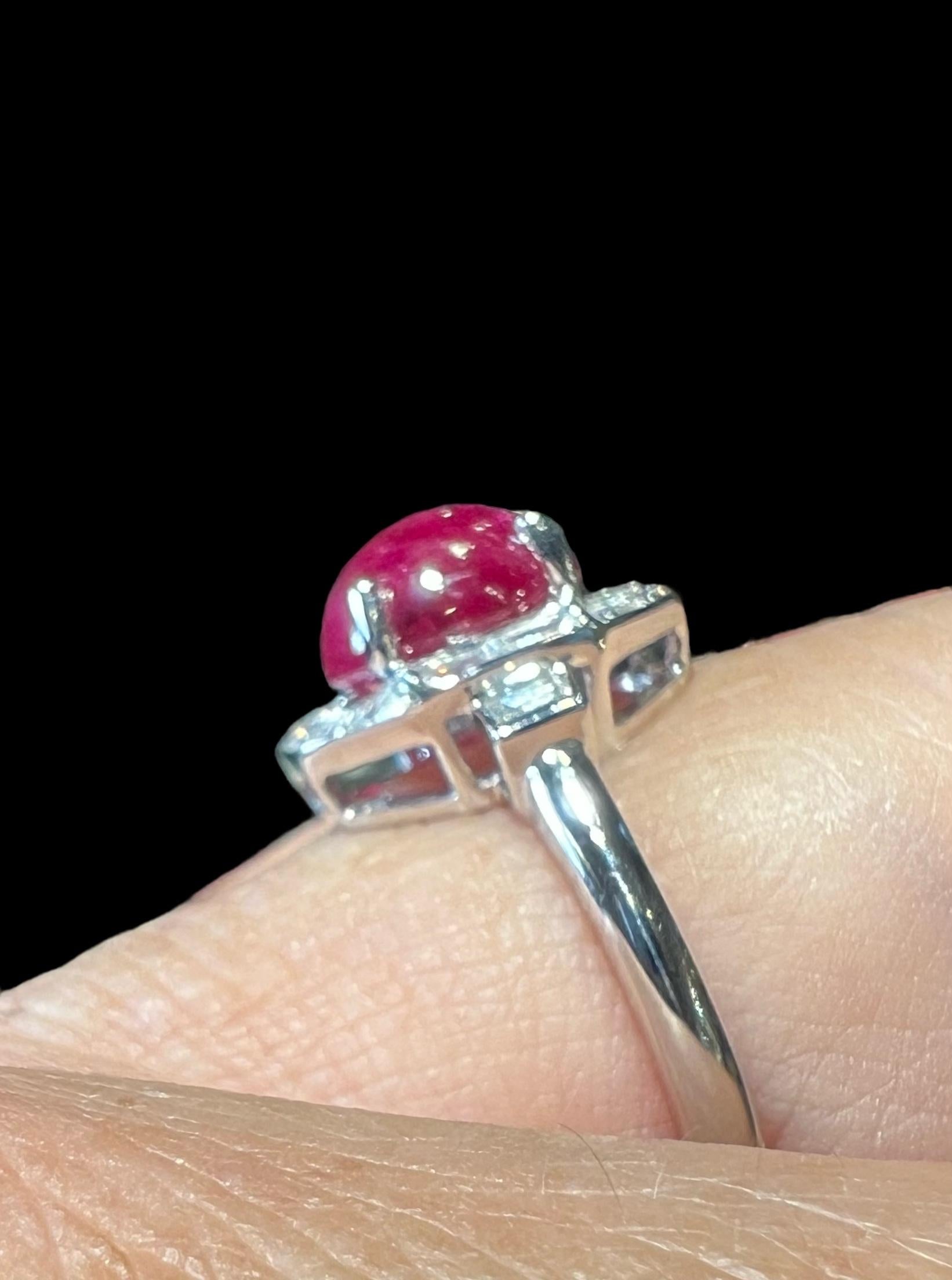 18 Carat Gold Ring Set With A Ruby Cabochon Surrounded By Diamonds 3