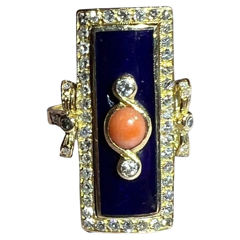 very pretty model from the end of the 19th century, set with a coral surrounded by blue enamel with a paving of old-cut diamonds
total weight: 8.84 g
finger size: 54.5 or 6-3/4
measurement of the decorated part: 2.7 cm by 1.3 cm
  slight accident in