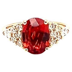 18 Carat Gold Ring with Orange Sapphire from Madagascar and Diamonds