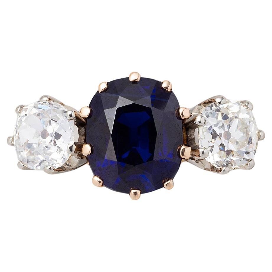 18 Carat Gold Sapphire and Diamond Three Stone Ring For Sale