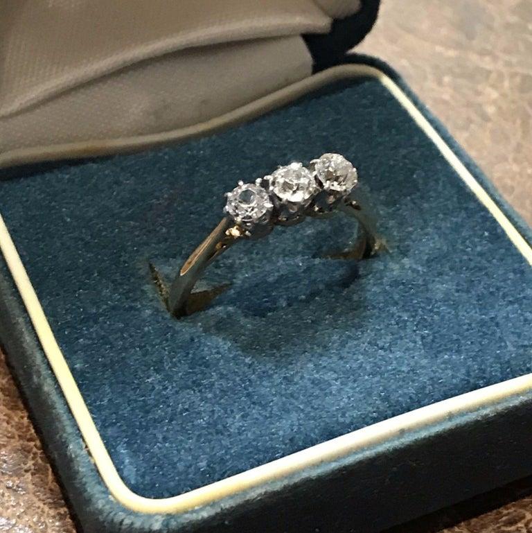 Wimbledon - Furniture are delighted to offer for sale this lovely vintage 18ct gold with platinum mounts three stone diamond ring

A lovely piece in excellent vintage condition throughout, the size is L 1/2 and it is easily sizable

The first stone