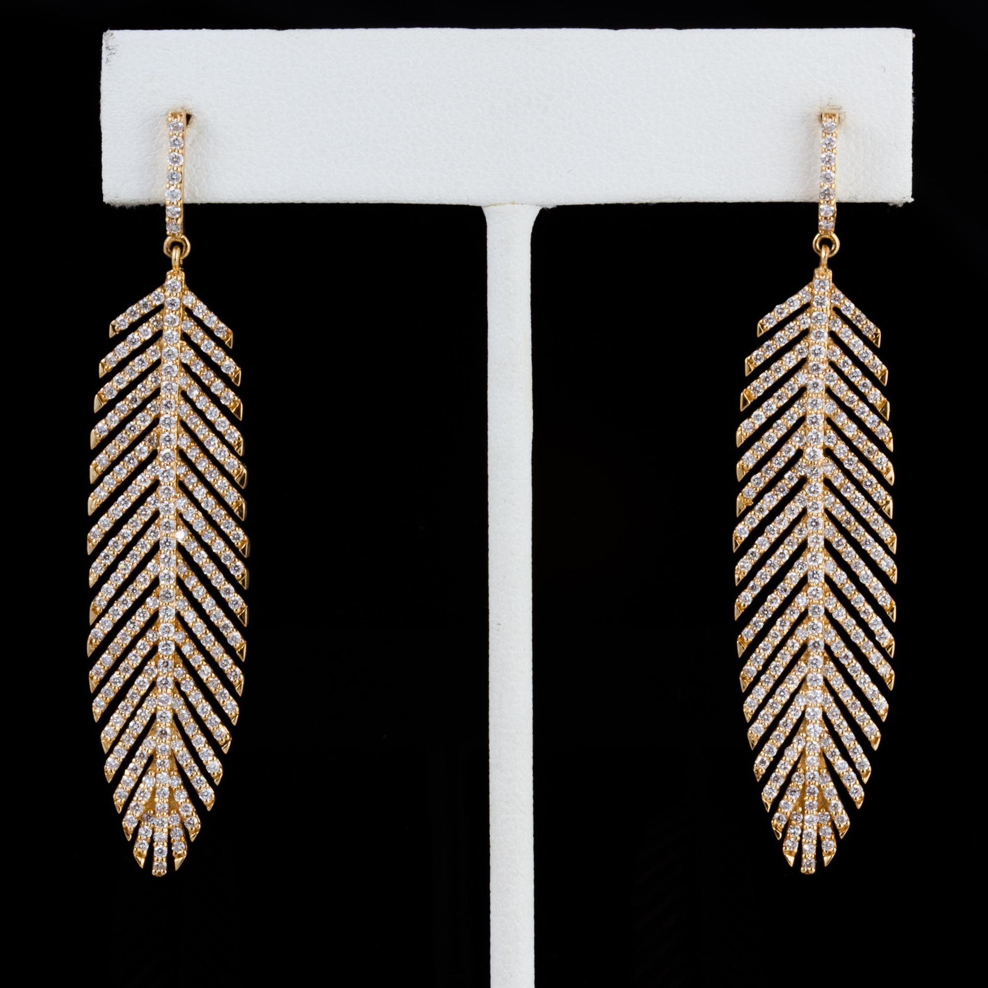Created using 500 hand set stones, these amazing dangle earrings are produced in the United States by a master European certified goldsmith.  

Created by noted jewelry designer David Meelheim Designs, David creates unique pieces incorporating rare,