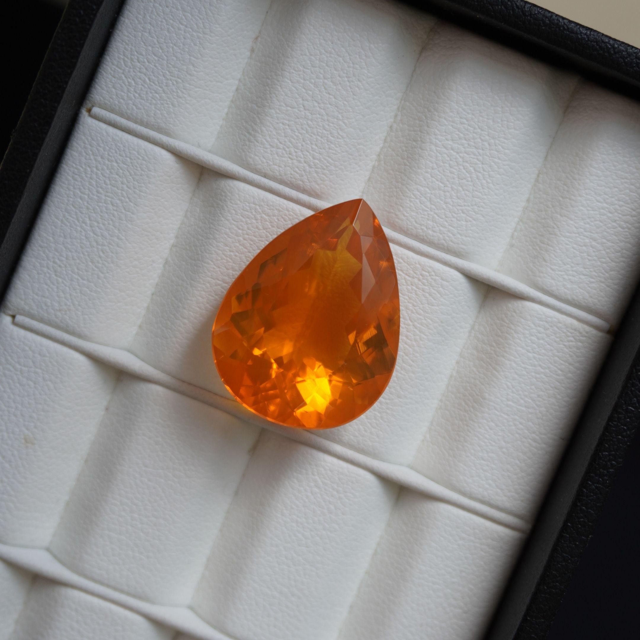 DETAILS
Fire Opal Weight: 18.19 CT
Measurements: 23.4 x 18.1 mm
Shape: Pear
Color: Intense Orange
Hardness: 5.5 - 6.5
Birthstone Month: October
Natural

SHIPPING
All items will be shipped in a safe and protective packaging within 1 day including