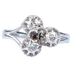 18 carat old claw trilogy white gold ring designed with round brillant diamonds