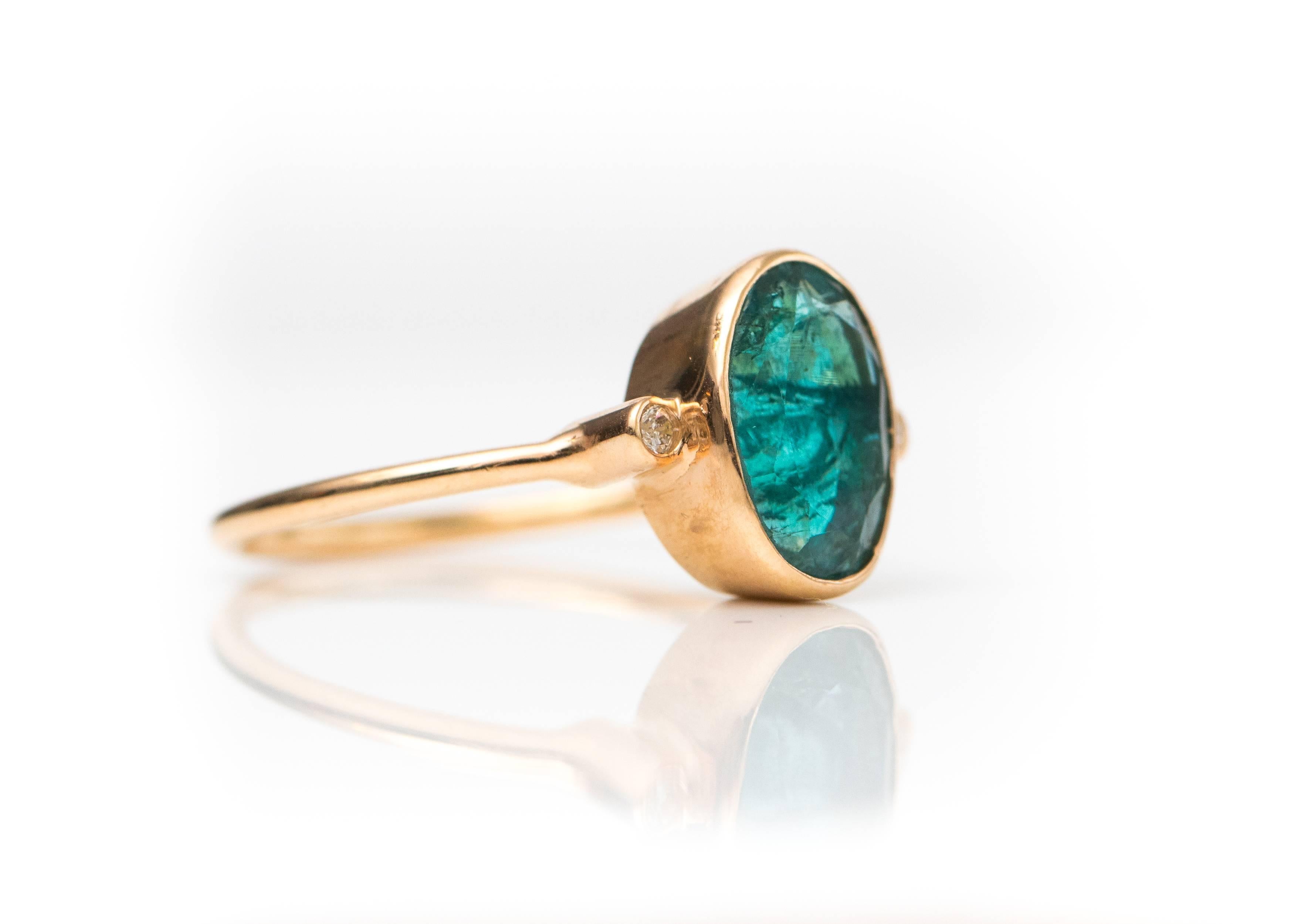 Modern 1.8 Carat Oval Emerald with Diamonds and 18 Karat Yellow Gold Ring For Sale