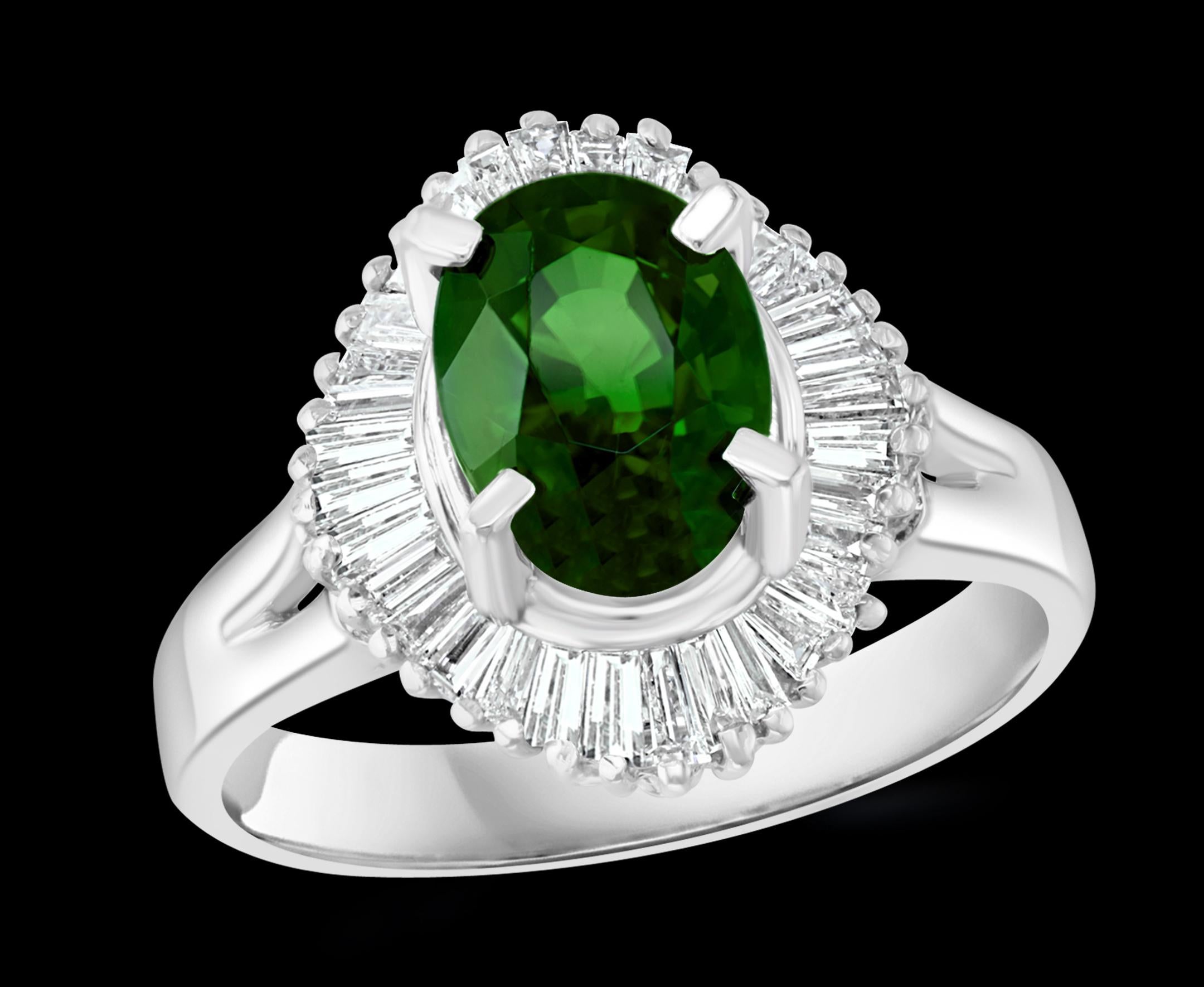 1.8 Carat Oval Tsavorite and 1.0 Carat Diamond  Ring In Platinum Size 6 Estate

Approximately 1.8  Carat Oval cut Tsavorite, Very high quality  with no color enhancement.
Approximately 1 Ct of Baguettes diamonds
Platinum 7 Gram
Size of the ring : 6